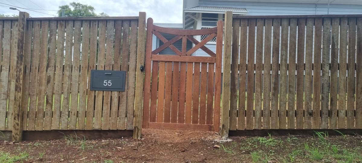 Stained timber fence and matching gate built in Toowoomba