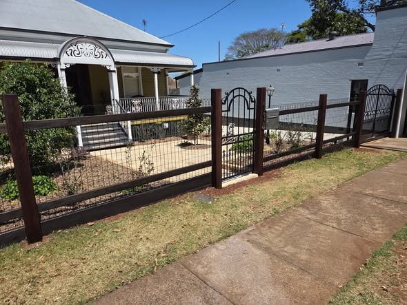 Timber post and steel infill fence with gate
