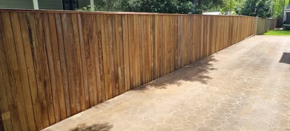 New timber paling fence along a driveway