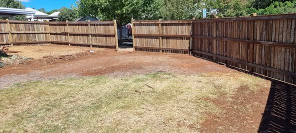 Timber boundary fence enclosing a back yard