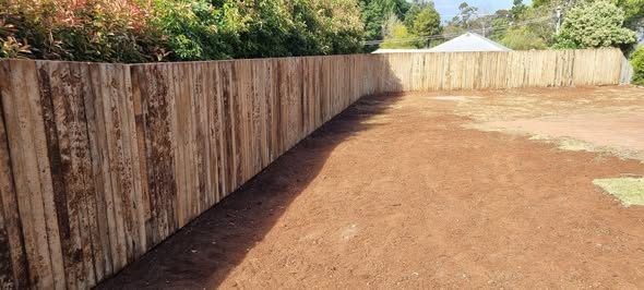 Long timber paling boundary fence